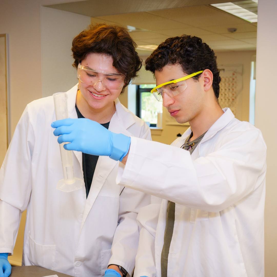 Two male students in lab coats